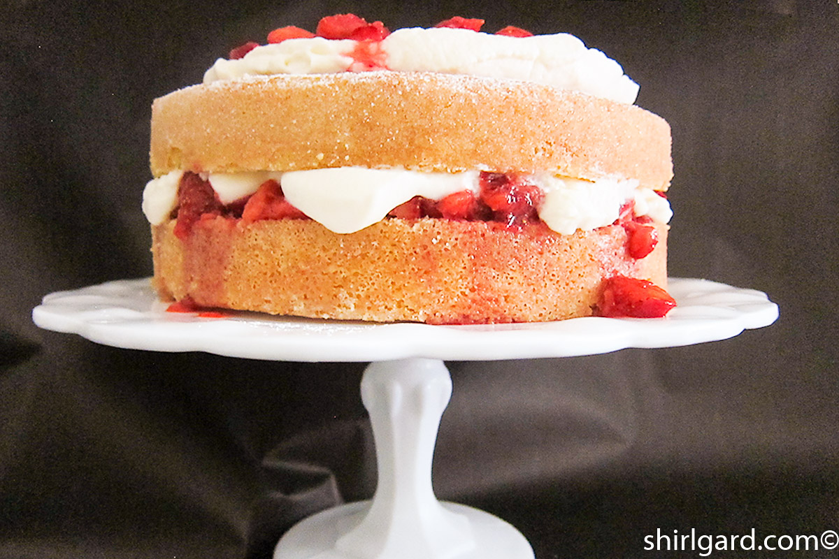 Creamy White Strawberry Shortcake on Cake Stand